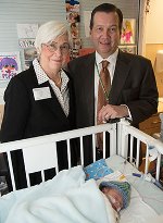 Jennifer Howse, PhD, and George Macones, MD, visit a patient in the St. Louis Children’s Hospital Neonatal Intensive Care Unit.