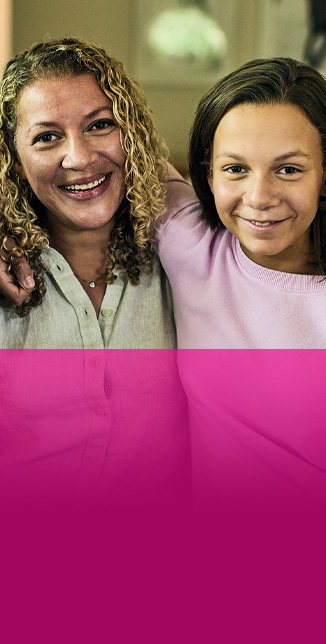 Maddy, a St. Louis Children’s patient, with her arms around her mom