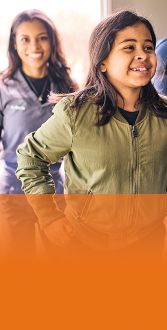 Close-up of a kid and St. Louis Children’s staff member in a Healthy Kids Express mobile unit