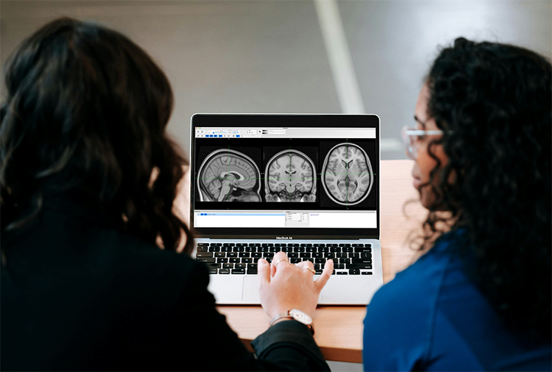 Two Doctors looking at exam images