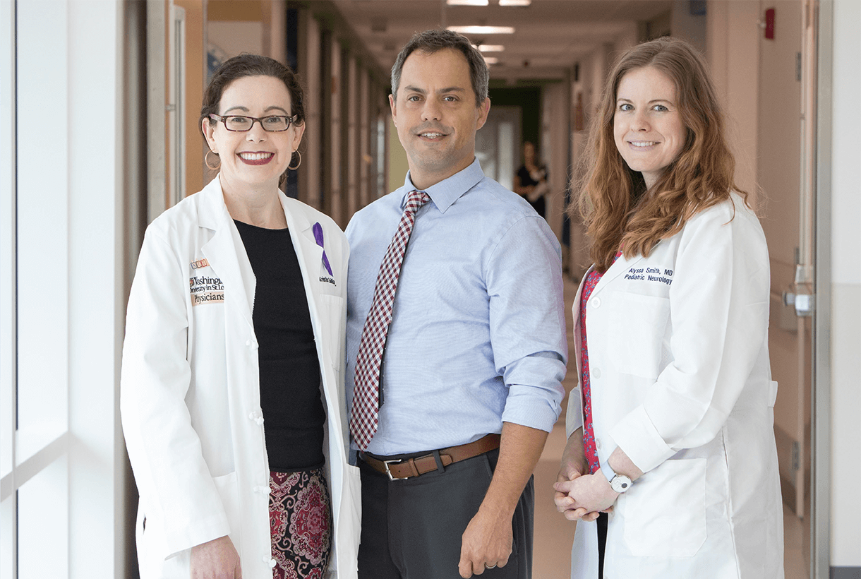 Three doctors in a hallway