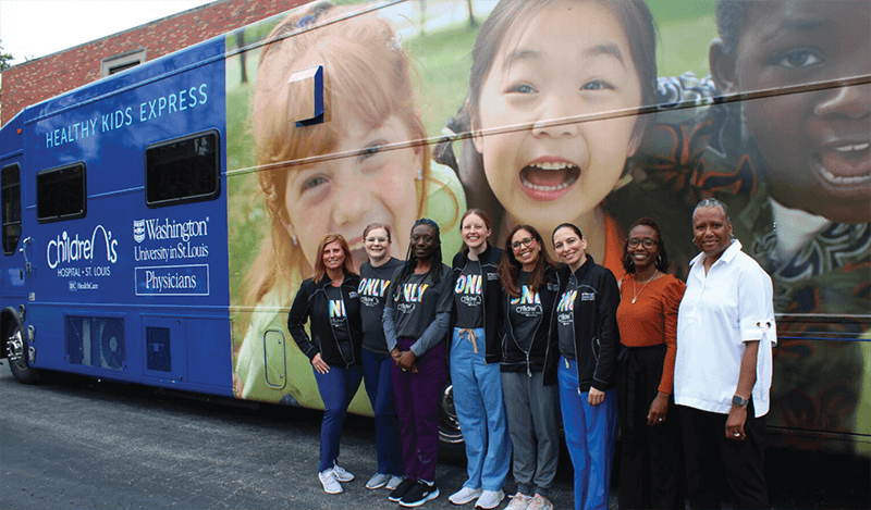 Staff in front of Mobile Health unit