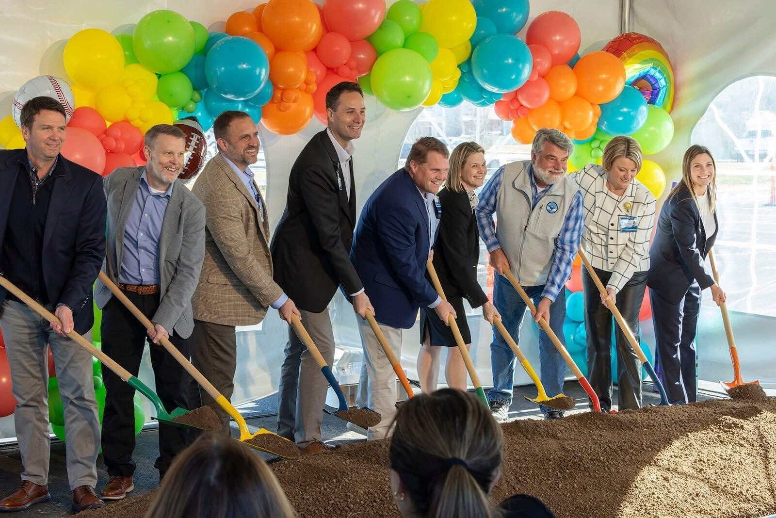The St. Louis Children’s at CoxHealth board, which includes leaders from CoxHealth, St. Louis Children’s Hospital, and BJC, celebrating the milestone using shovels.