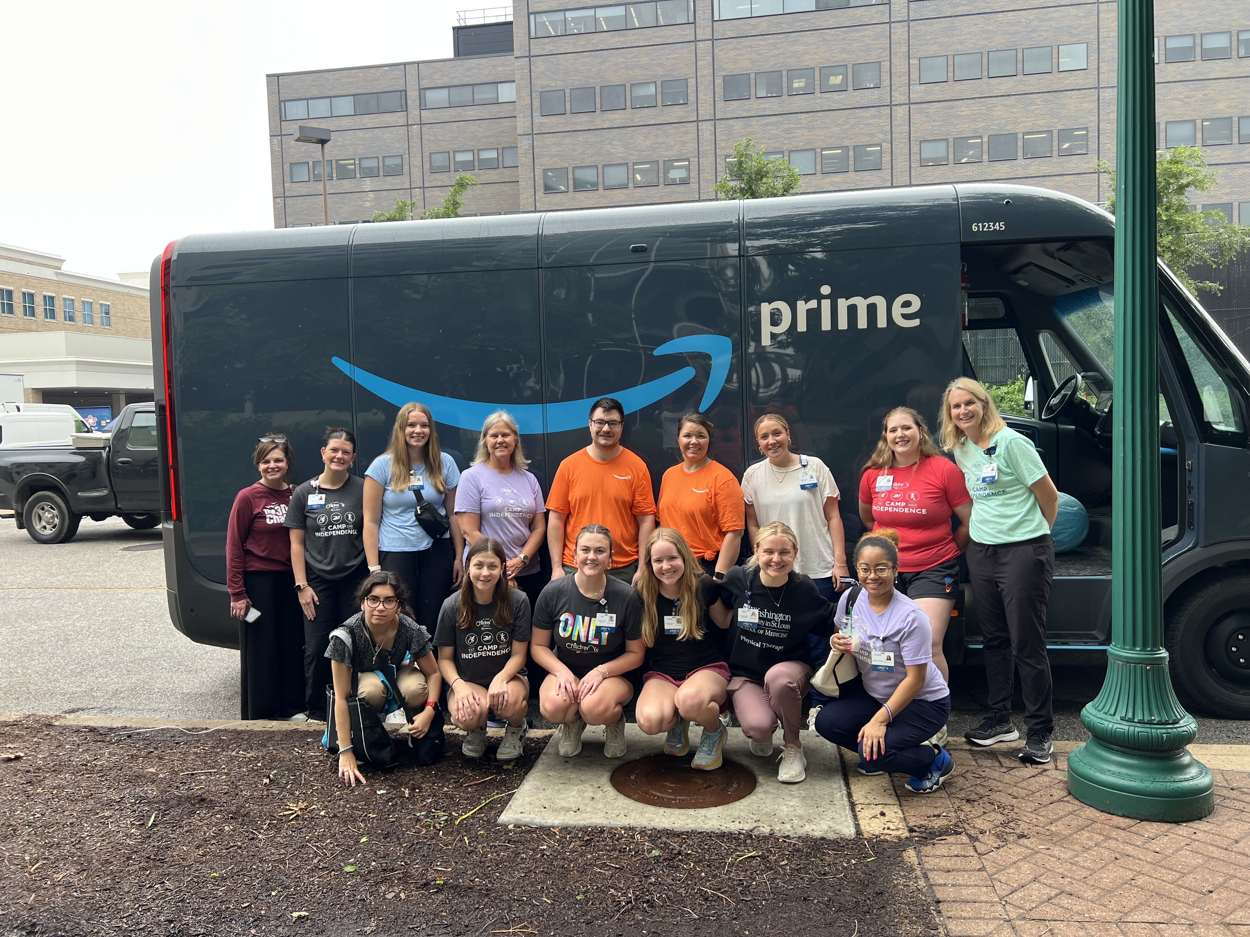 Amazon team in front of truck
