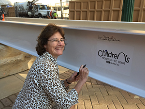 Joan Magruder signing beam