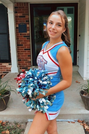 Nina in her cheer uniform