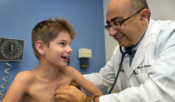 Doctor with patient for Genetic Testing of Pediatric Cancer