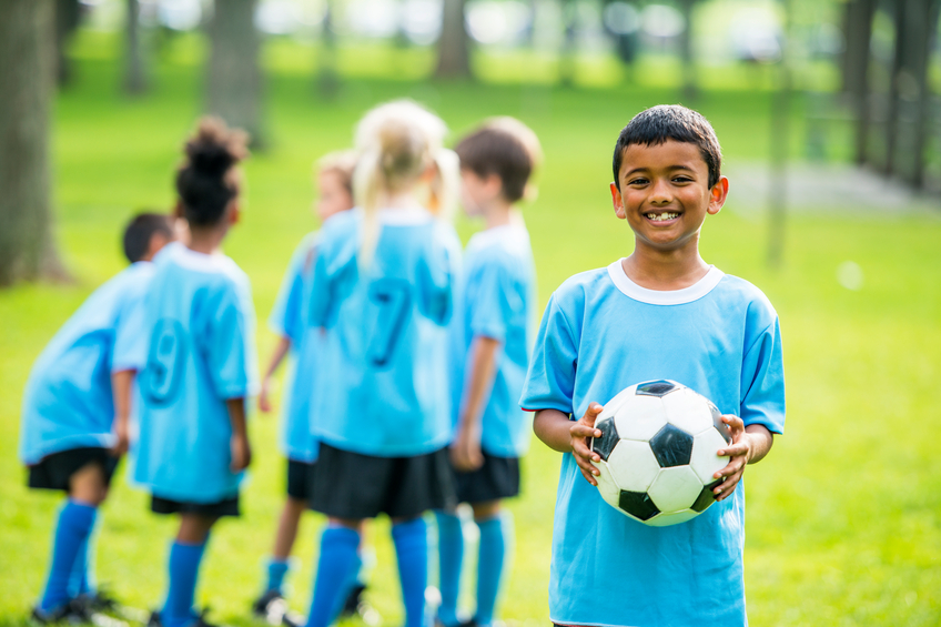 Child playing soccer