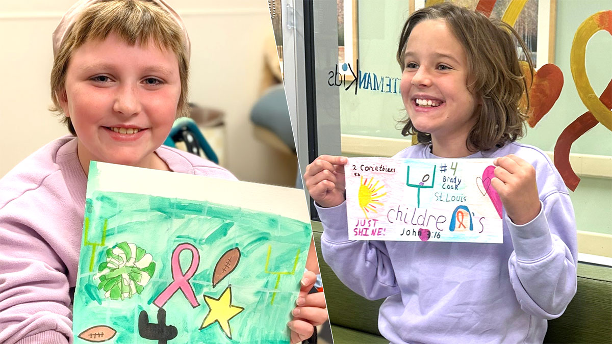 Two St. Louis Children's Hospital patients, Cally and Raelle, showing their custom football cleat design artwork