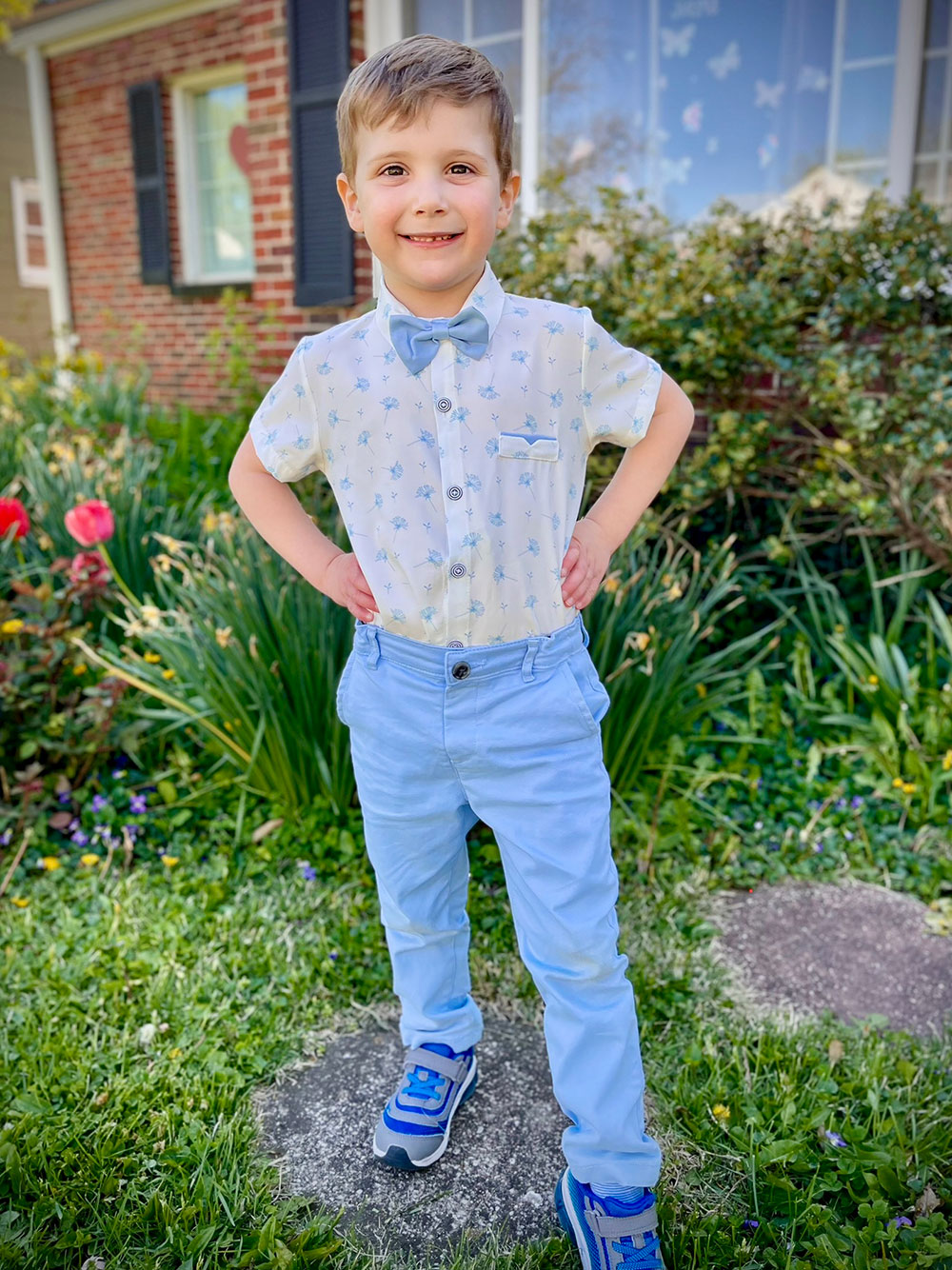 David standing outside in front of a house