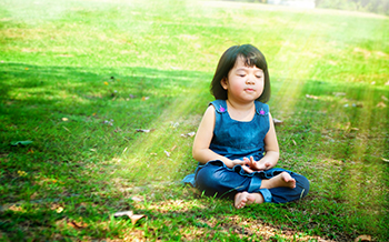 Child practicing mindfulness