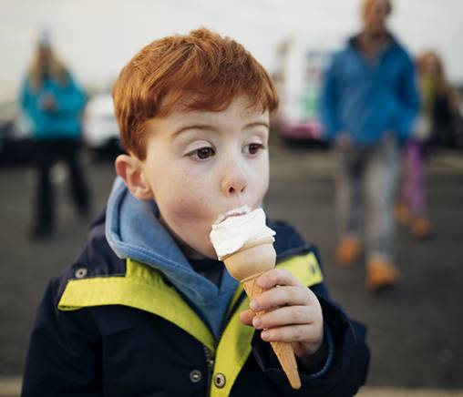 Young boy eating ice cream