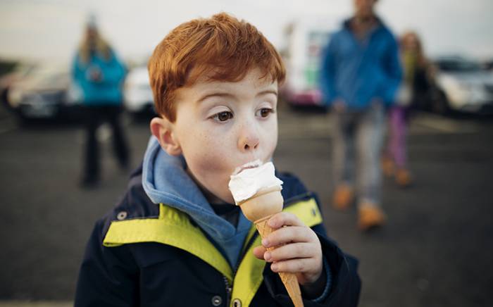 Young boy eating ice cream