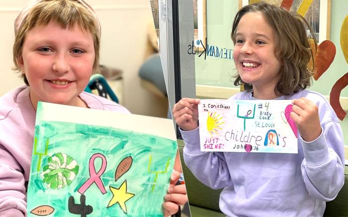 Two St. Louis Children's Hospital patients, Cally and Raelle, showing their custom football cleat design artwork